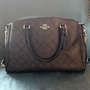 Brown and black coach handbag with matching wallet (purchased separately)